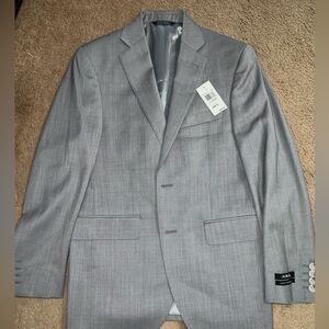 36S New blazer from Saks Fifth Avenue. fitted look that lays perfect.